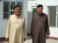 Drs. Aziz and Atiq Kamali in courtyard of the first 20-bed hospital in Afghanistan, summer 2011