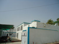 Gated entrance to The Omar Kamali Medical Center, Jalalabad Afghanistan, summer 2011