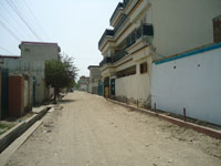 The main street leading to The Omar Kamali Medical Center, Jalalabad Afghanistan, summer 2011